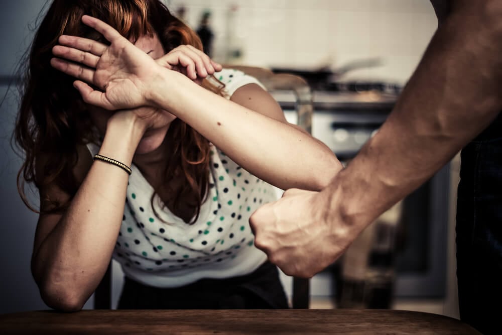 Women crossing her arms for defense